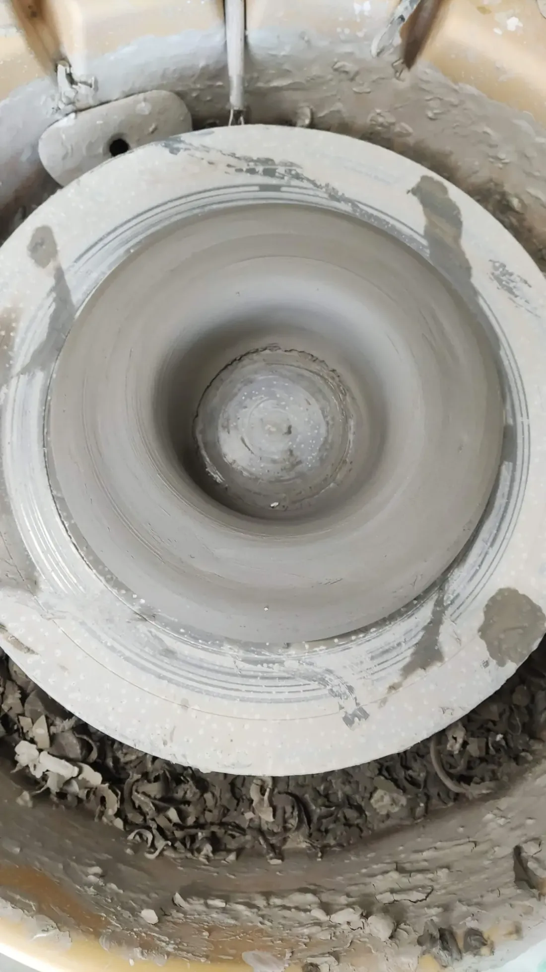 A bowl taking shape on the wheel