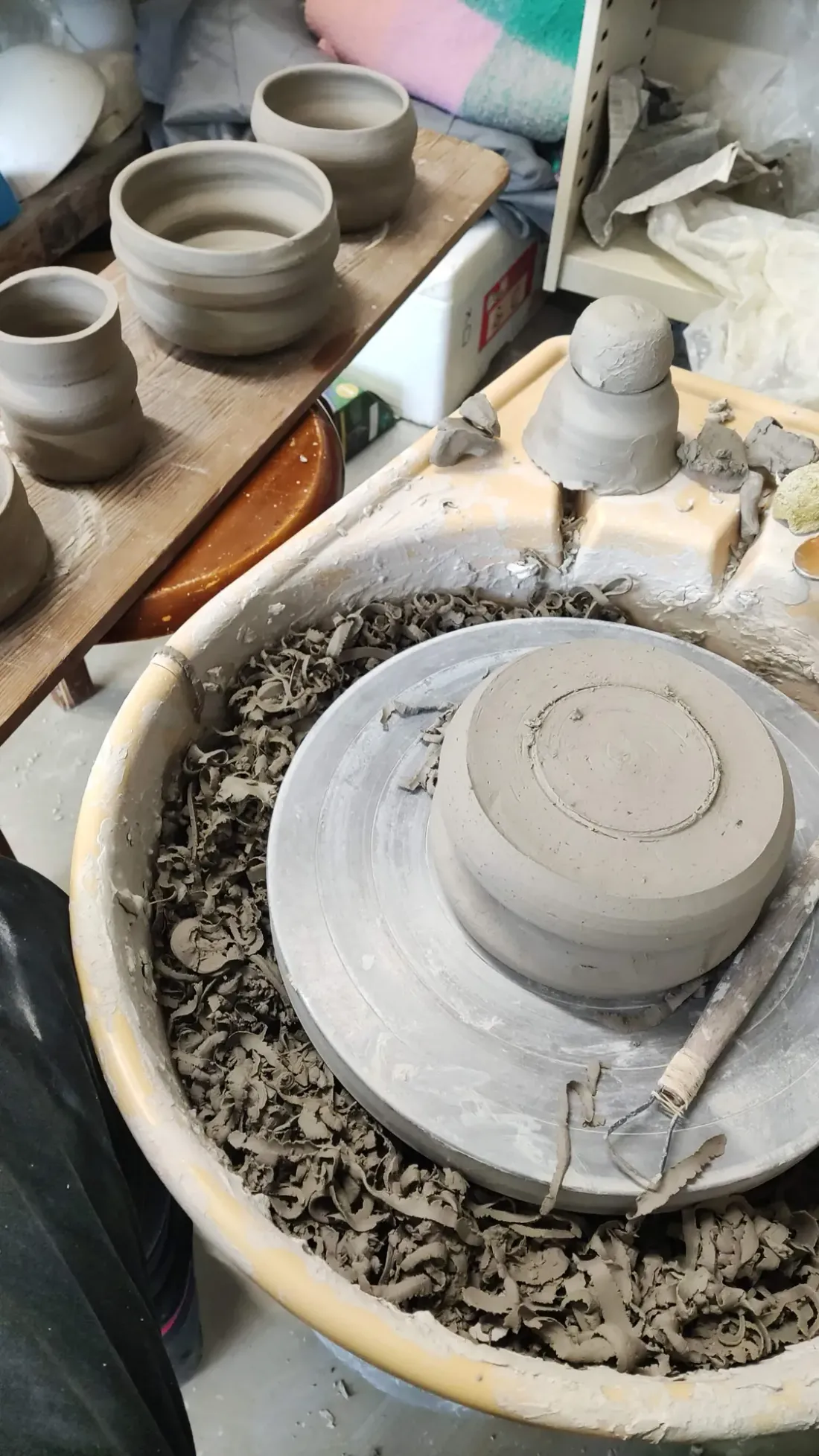 Greenware cups drying in the studio