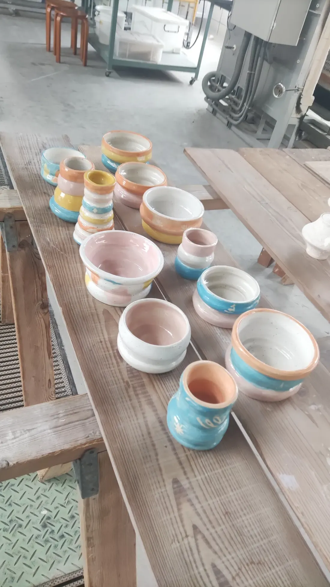 Freshly glazed pieces lined up in the Tajimi workshop