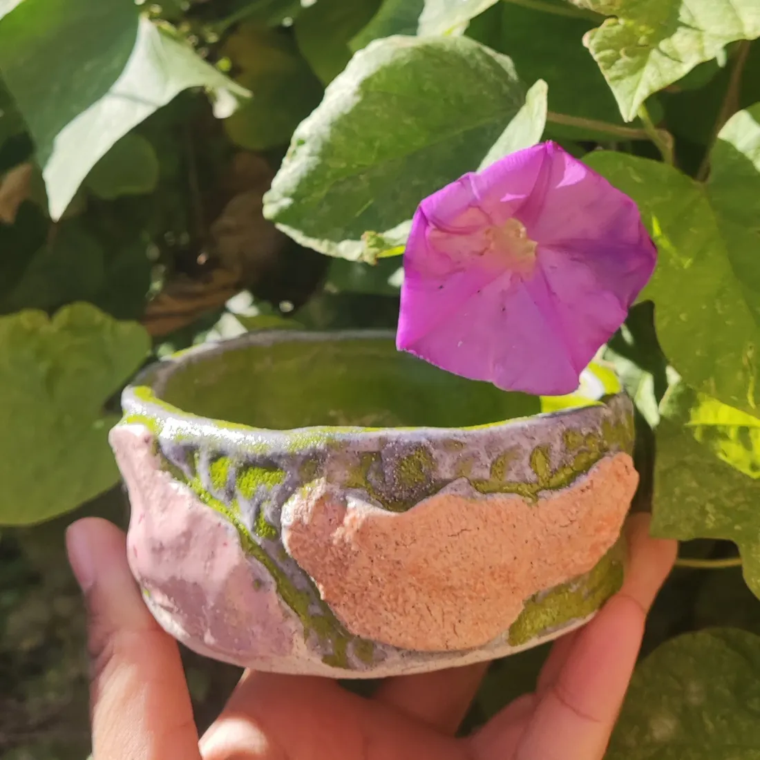Green-glazed cup with a dried-citrus relief