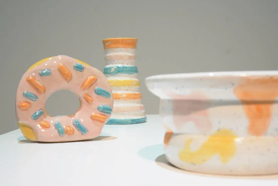 The series gathered: donut, rainbow-striped vase and pastel bowls