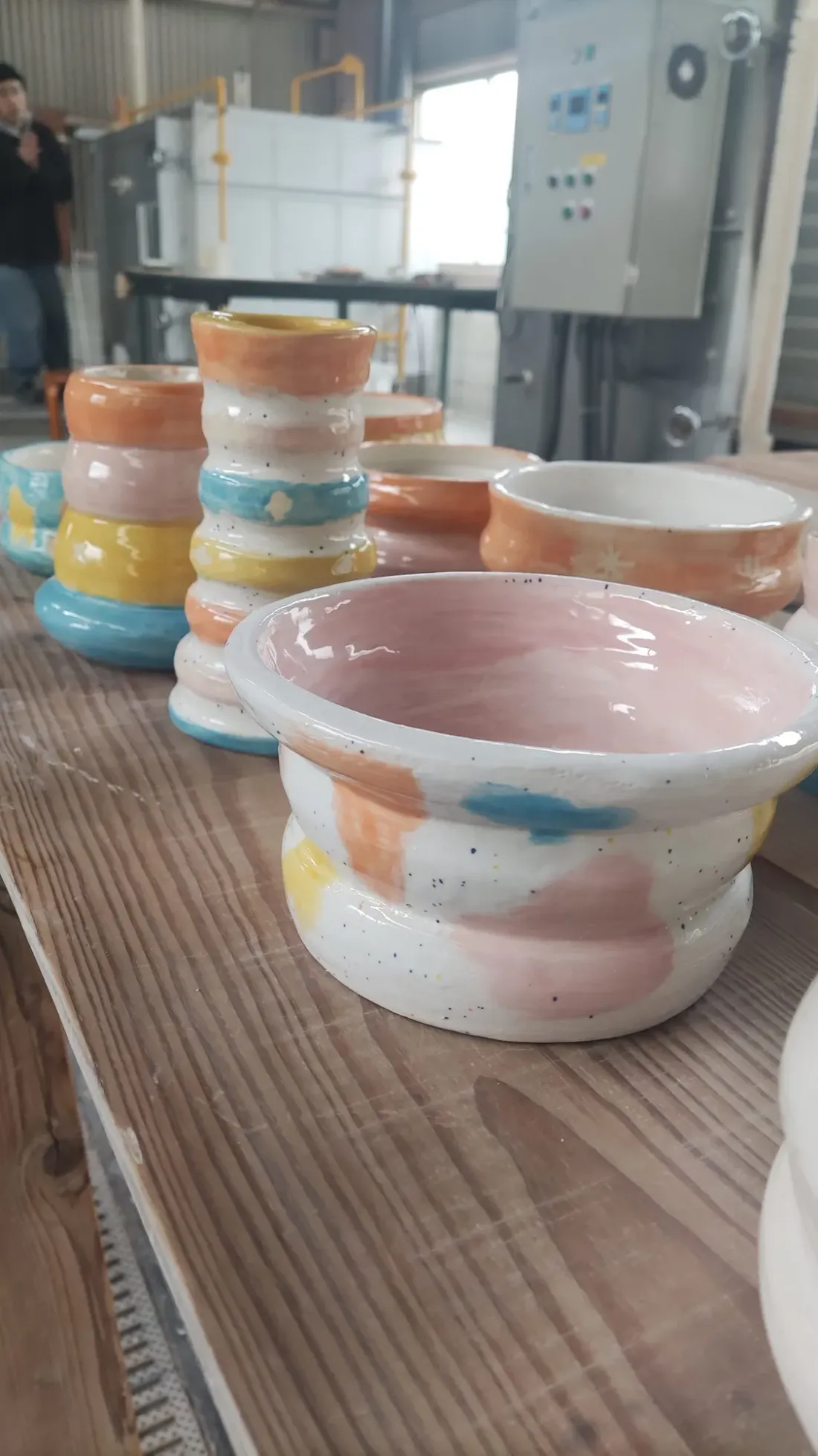 Pale-pink glazed bowl, in the workshop