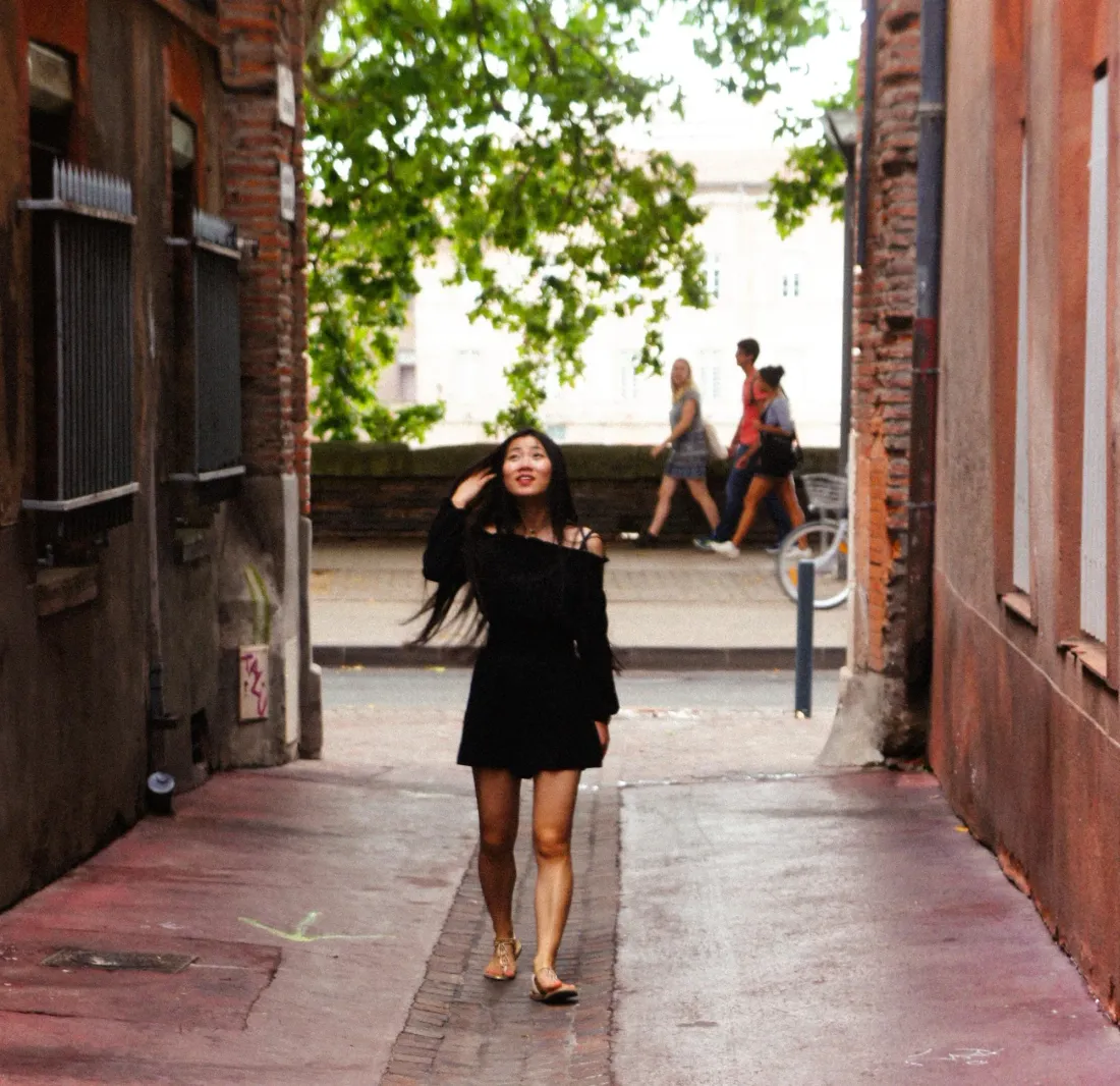 A figure in a brick alley, with Wei Di