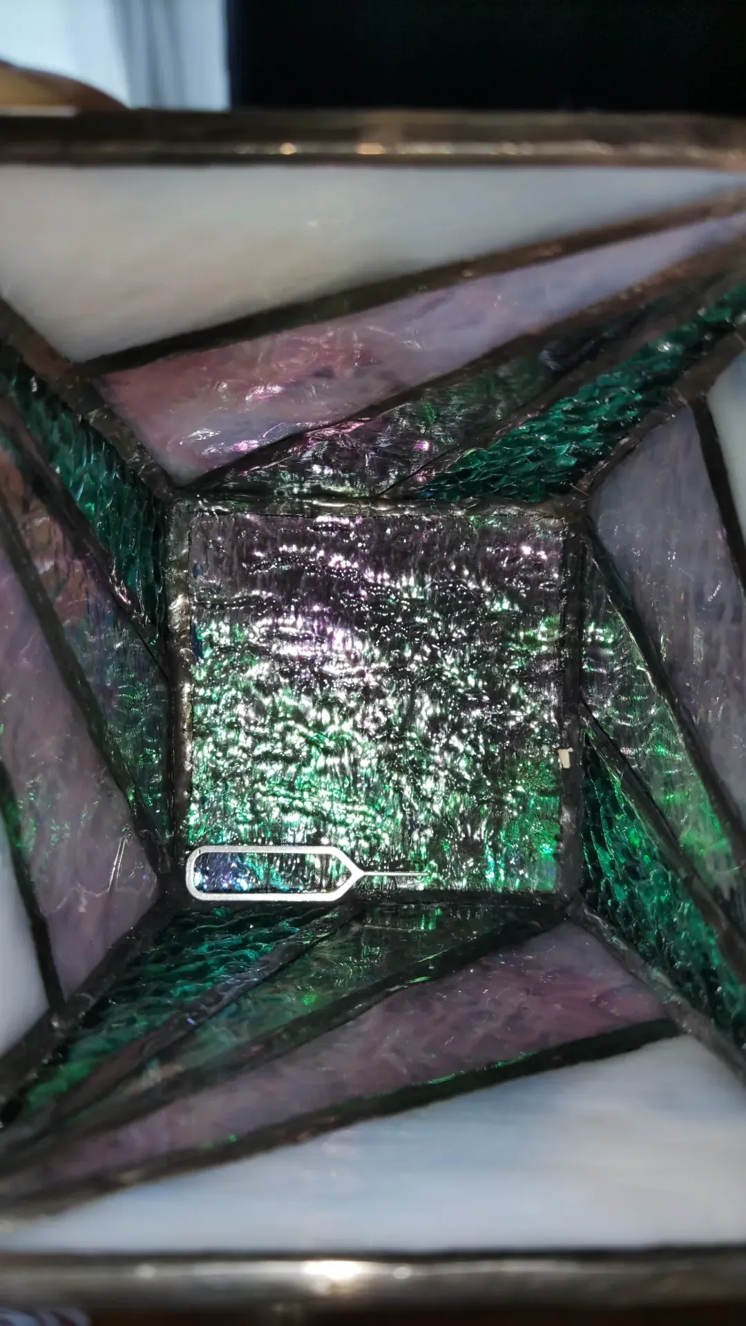 Stained-glass box from above, iridescent green and purple glass