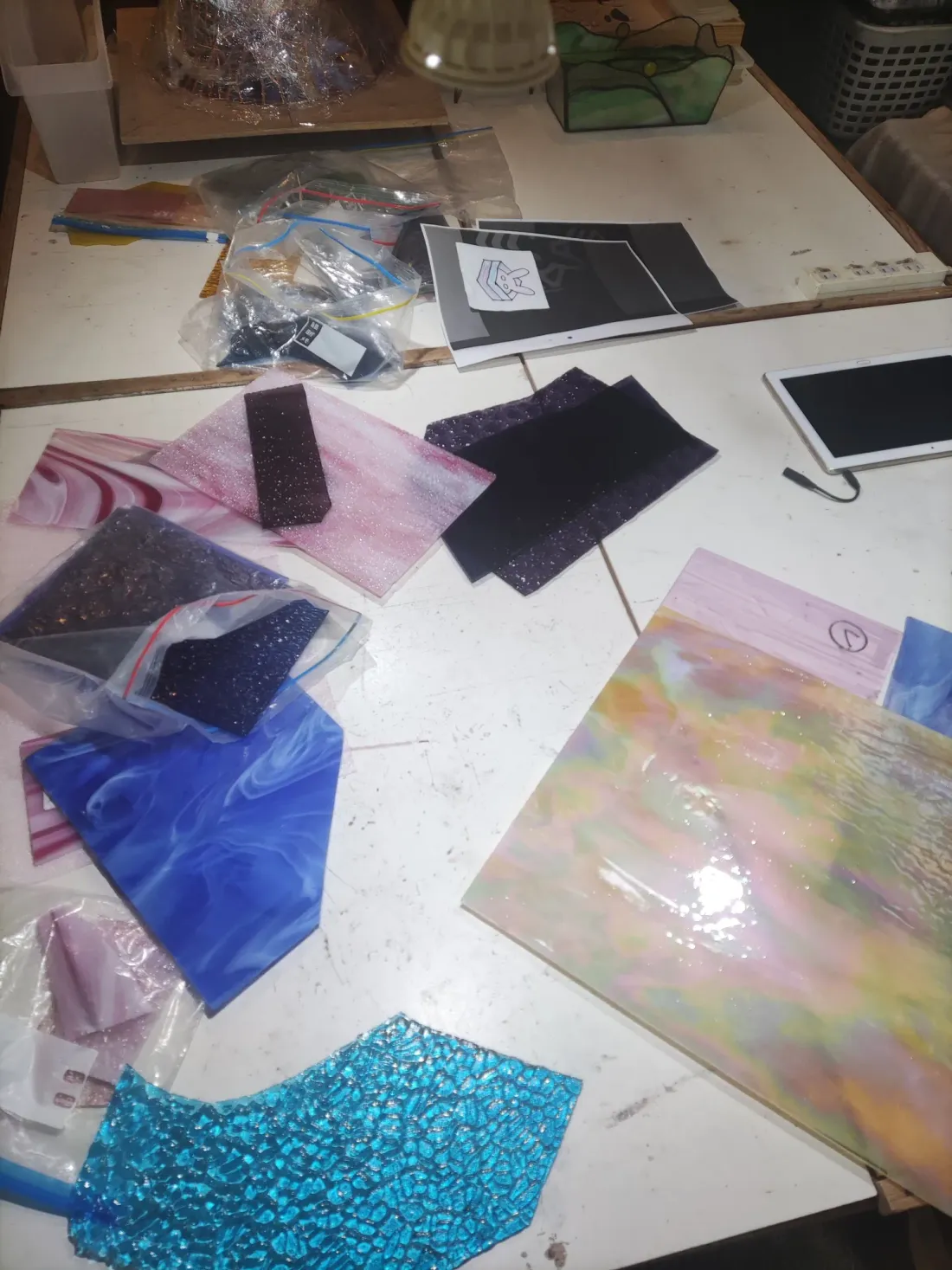 Sheets of coloured glass, ready to be cut